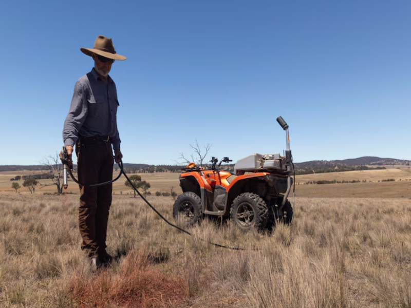 A farmer spot-spraying herbicide on African lovegrass